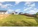 Spacious fenced backyard showcasing the expansive green space at 155 Jade St, Smithfield, NC 27577