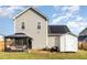 Home exterior and fenced backyard featuring a patio, shed, and solar panels at 155 Jade St, Smithfield, NC 27577