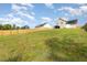 Large fenced in backyard with lush green grass perfect for outdoor enjoyment at 155 Jade St, Smithfield, NC 27577