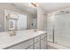 Bathroom boasting a double sink vanity, large mirror, and tiled walk-in shower at 155 Jade St, Smithfield, NC 27577