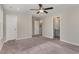 Bedroom featuring a ceiling fan, ensuite bath, neutral colors and carpet at 155 Jade St, Smithfield, NC 27577