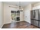 Dining area with stainless steel refrigerator and sliding glass doors to an outdoor patio at 155 Jade St, Smithfield, NC 27577