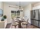 Cozy dining area with a round table, chandelier, and sliding door to the patio at 155 Jade St, Smithfield, NC 27577