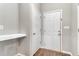 Hallway featuring access to a backyard exterior door and interior door, with a built-in shelf at 155 Jade St, Smithfield, NC 27577