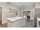 Open kitchen with white cabinets, stainless steel appliances, and a center island at 155 Jade St, Smithfield, NC 27577