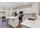 Well-equipped kitchen with a center island, quartz countertops, and stainless steel appliances at 155 Jade St, Smithfield, NC 27577