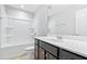 Bathroom features dark cabinets, white shower and toilet at 1600 Tinos Overlook Way, Apex, NC 27502