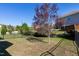 The home's backyard features a lush lawn, privacy fence and beautiful landscaping, great for relaxing outdoors at 1707 Capstone Dr, Durham, NC 27713