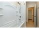 Bathroom featuring a shower and tub combination with white tile and modern fixtures at 1707 Capstone Dr, Durham, NC 27713