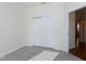 Bedroom featuring a closet with sliding doors and wood-look flooring at 1707 Capstone Dr, Durham, NC 27713