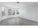 Bright bedroom with large windows, hardwood floors and neutral paint at 1707 Capstone Dr, Durham, NC 27713
