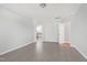 A spacious bedroom with hardwood floors and an ensuite bathroom at 1707 Capstone Dr, Durham, NC 27713