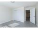 Bedroom featuring wood-look floors, closet with sliding doors, natural light, and neutral walls at 1707 Capstone Dr, Durham, NC 27713