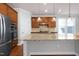 Spacious kitchen with stainless steel appliances, granite countertops, and a large island, great for cooking at 1707 Capstone Dr, Durham, NC 27713