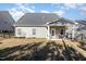 Inviting backyard with a covered patio, perfect for outdoor entertaining and relaxation at 192 Kensington Dr, Spring Lake, NC 28390