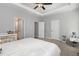 Bright and airy bedroom with plush carpet, tray ceiling, and multiple closets at 192 Kensington Dr, Spring Lake, NC 28390