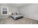 Simple bedroom with a comfortable bed and bedside tables, offering a calming and minimalist space at 192 Kensington Dr, Spring Lake, NC 28390