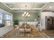 Elegant dining room featuring wainscoting, a chandelier, and a view of the kitchen at 192 Kensington Dr, Spring Lake, NC 28390
