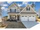 Inviting two-story home with a two-car garage, porch, and landscaped front yard at 192 Kensington Dr, Spring Lake, NC 28390