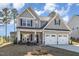 Charming two-story home with a two-car garage and manicured lawn at 192 Kensington Dr, Spring Lake, NC 28390