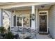 Inviting front porch with stone accents, decorative wreath, and a 'Welcome' sign at 192 Kensington Dr, Spring Lake, NC 28390