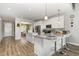Bright, updated kitchen with granite countertops, white cabinetry, stainless appliances, and bar seating at 192 Kensington Dr, Spring Lake, NC 28390