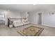Cozy loft featuring neutral color palette with large area rug and comfortable seating at 192 Kensington Dr, Spring Lake, NC 28390