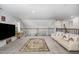 Spacious loft with plush carpet, comfortable seating, and ample natural light, perfect for relaxation and entertainment at 192 Kensington Dr, Spring Lake, NC 28390