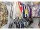 Organized walk-in closet with an array of hanging clothes, shelves, and space for shoes and accessories at 192 Kensington Dr, Spring Lake, NC 28390