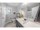 Well-lit bathroom with a single vanity and a combination shower and tub at 20 Crane Dr, Louisburg, NC 27549