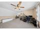 Spacious bonus room with comfortable seating, a desk, and multiple windows offering plenty of natural light at 20 Crane Dr, Louisburg, NC 27549