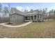 Beautiful exterior of a two-story home featuring professional landscaping and a welcoming front porch at 20 Crane Dr, Louisburg, NC 27549