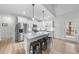 Bright, modern kitchen featuring a large island with stool seating at 20 Crane Dr, Louisburg, NC 27549
