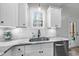 Well-lit kitchen with stainless steel sink and modern fixtures at 20 Crane Dr, Louisburg, NC 27549