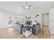 Cozy living room with stone fireplace, ceiling fan, and natural light at 20 Crane Dr, Louisburg, NC 27549