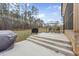 Enjoy the outdoors on this concrete patio with a seating area and grill overlooking a wooded backyard at 20 Crane Dr, Louisburg, NC 27549