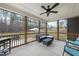 Relaxing screened porch with comfortable seating, providing a serene outdoor living space at 20 Crane Dr, Louisburg, NC 27549