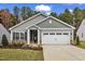 Charming single-Gathering home with a two-car garage, manicured lawn, and beautiful exterior details at 204 Brickwell Way, Youngsville, NC 27596