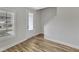 Entryway featuring a light-filled space with hardwood floors and staircase access at 204 Jetson Creek Way, Youngsville, NC 27596