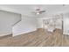 Inviting open floor plan with hardwood floors connecting living, dining, and kitchen areas at 204 Jetson Creek Way, Youngsville, NC 27596