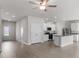 Open-concept living space flowing into the kitchen, showcasing modern finishes and a bright atmosphere at 204 Shelfit Trl, Oxford, NC 27565
