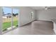 Open living space with sliding glass door overlooking the backyard and modern hardwood flooring at 204 Shelfit Trl, Oxford, NC 27565