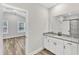 En-suite bathroom boasts granite vanity and opens to light-filled primary bedroom at 208 Brickwell Way, Youngsville, NC 27596