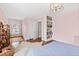 Bright bedroom with hardwood floors, built-in shelving, and a neutral color palette at 2147 Wake Dr, Raleigh, NC 27608