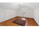 Bedroom featuring hardwood floors, natural light, and freshly painted walls at 2147 Wake Dr, Raleigh, NC 27608