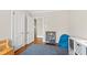 Inviting bedroom with hardwood floors, an area rug, and comfortable seating at 2147 Wake Dr, Raleigh, NC 27608