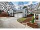Charming home with a two-car garage, new landscaping, and a basketball hoop at 2147 Wake Dr, Raleigh, NC 27608