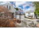 Back of the house with two-car garage and driveway leading up at 2147 Wake Dr, Raleigh, NC 27608