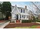 Charming two-story home with landscaped front yard, brick walkway, covered porch and inviting curb appeal at 2147 Wake Dr, Raleigh, NC 27608