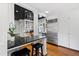 Modern kitchen with stainless steel appliances, granite countertops, and ample cabinet space at 2147 Wake Dr, Raleigh, NC 27608